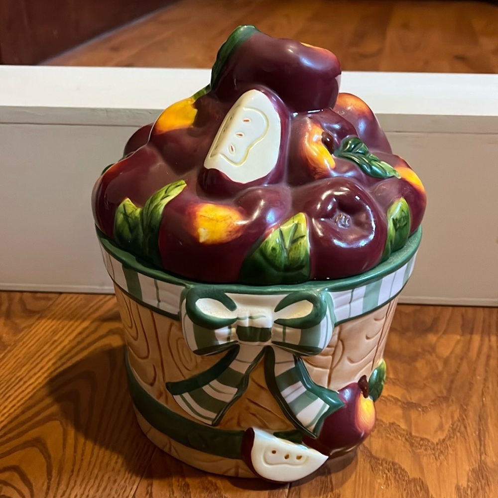 Young’s exclusive 1999 ceramic basket of apples canister 8 1/2” tall